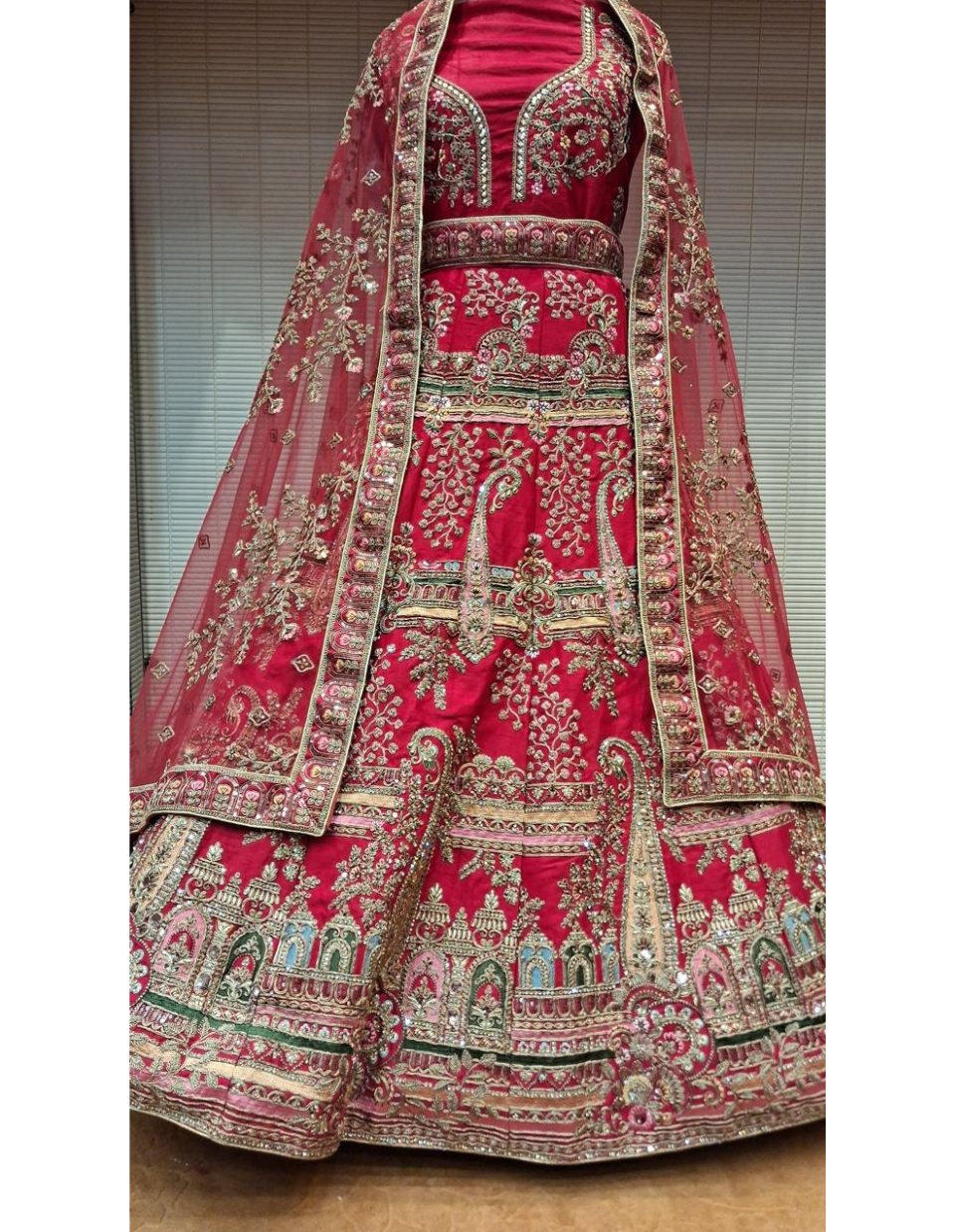 Bright Red Bridal Lehenga with Temple Motif Embroidery and Green Accents