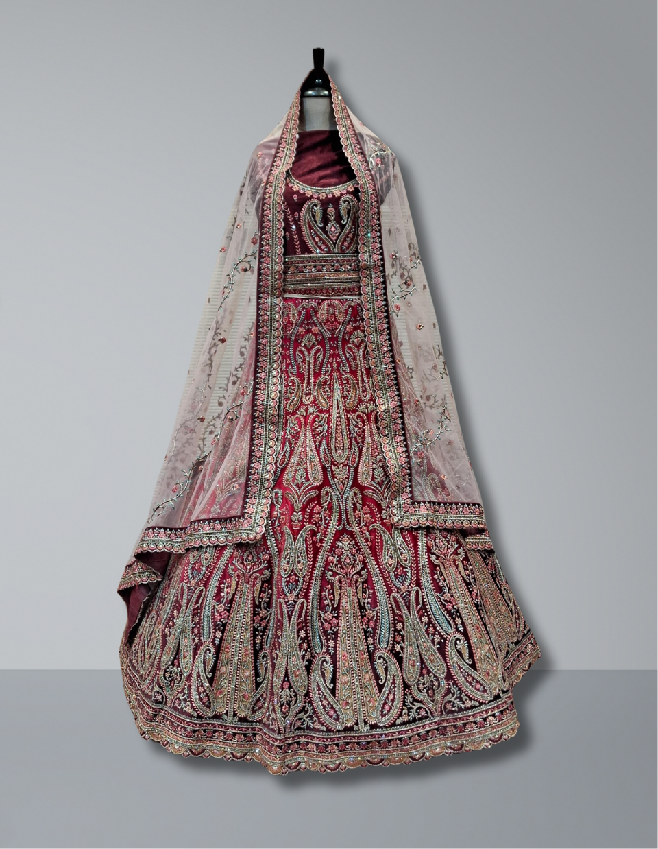 Maroon Bridal Lehenga with Paisley Motifs and Delicate Pastel Net Dupatta