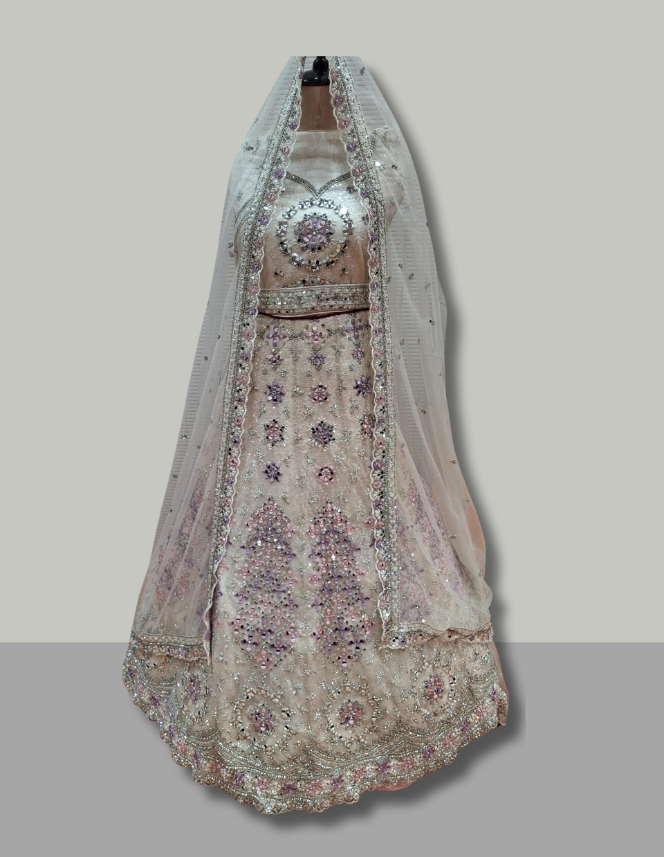 Soft Peach Bridal Lehenga in Net with Lavender and Silver Embellishments