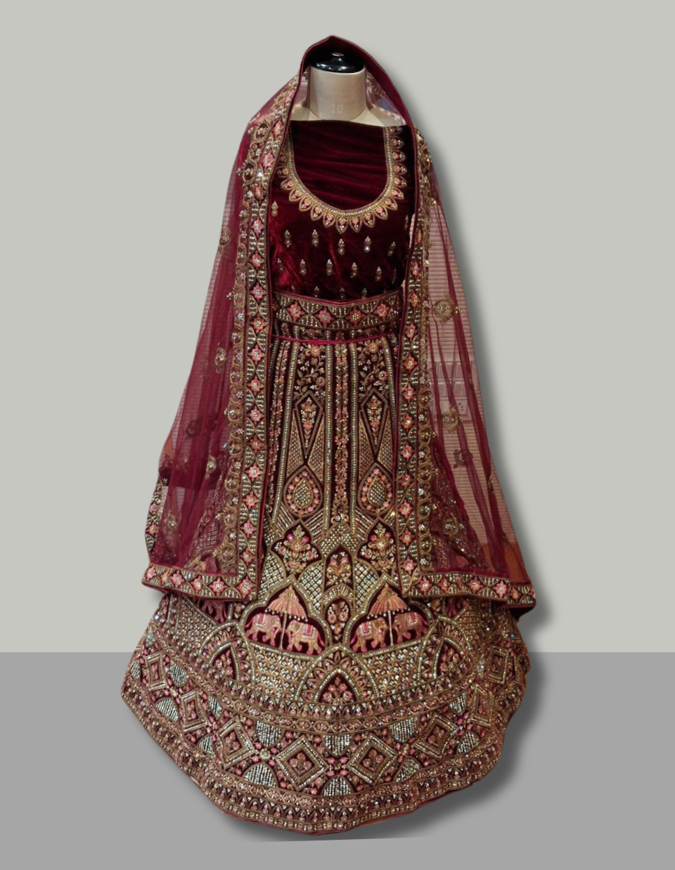 Regal Maroon Velvet Bridal Lehenga with Zardosi and Elephant Motif Embroidery
