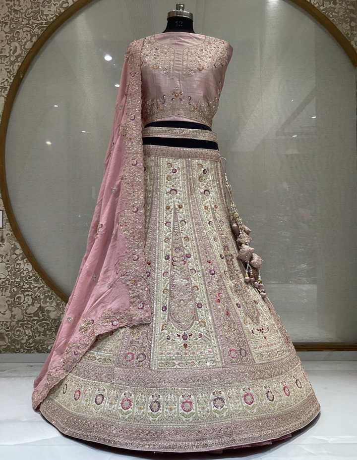 Soft peach bridal lehenga with stunning embroidery and a matching dupatta