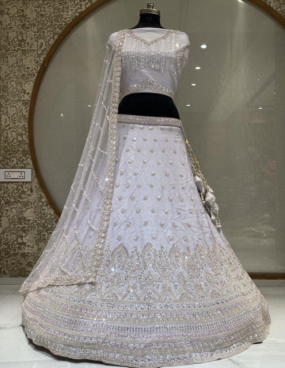 Elegant Light-Colored Wedding Lehenga with Intricate Embroidery