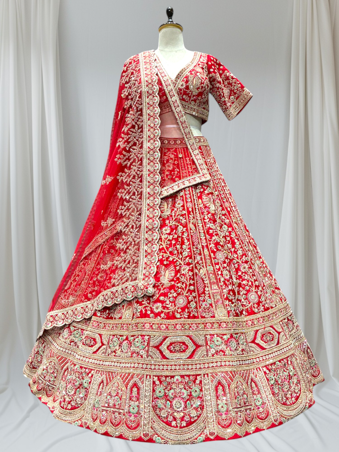 Red and gold embroidered traditional bridal lehenga 