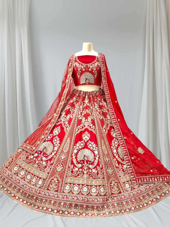 Royal Peacock Bridal Lehenga Available In Red And Rani Colour